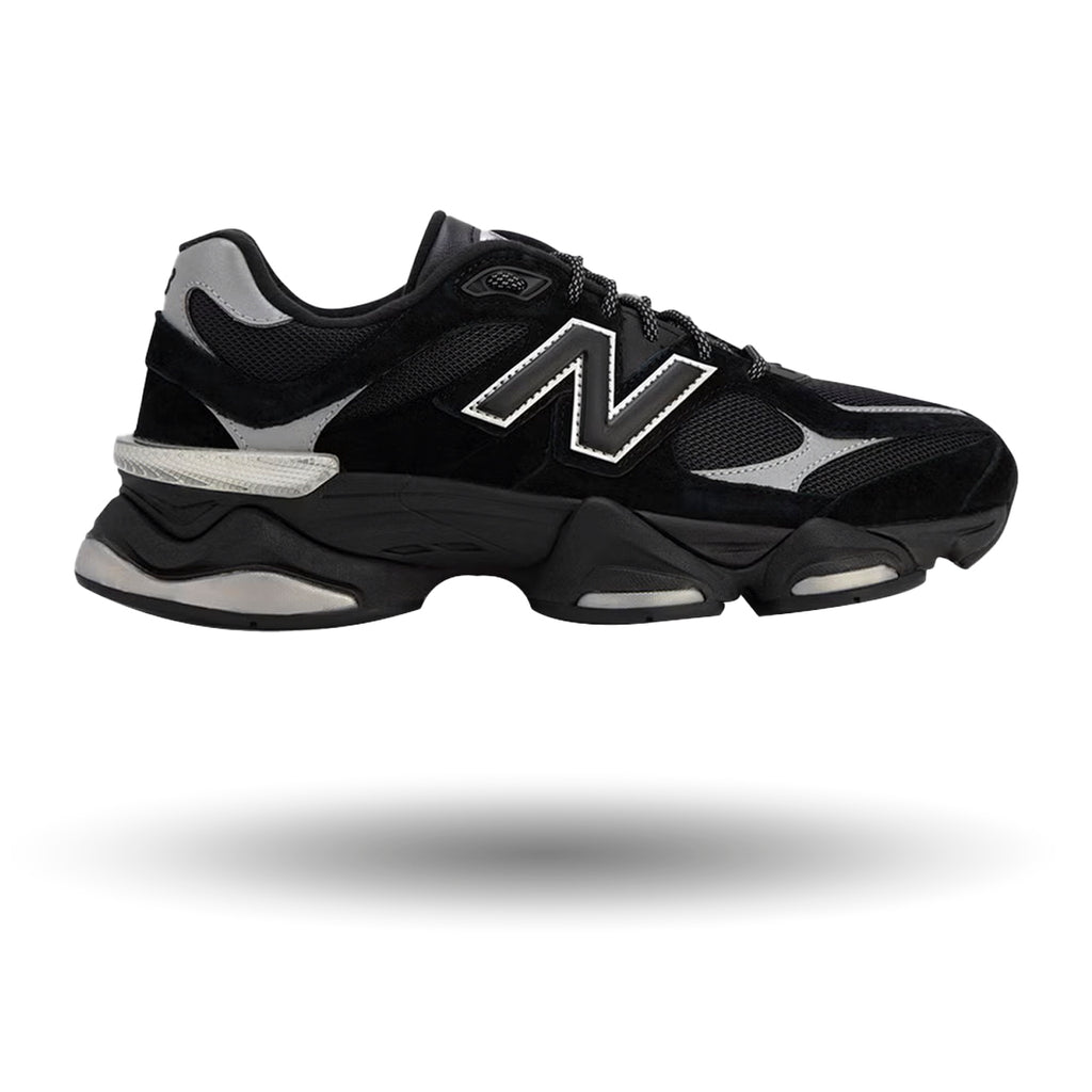 Black athletic shoe with gray accents on a white background