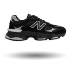 Black athletic shoe with gray accents on a white background