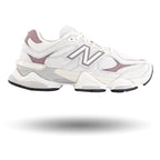 White and gray sneakers with New Balance logo on a white background