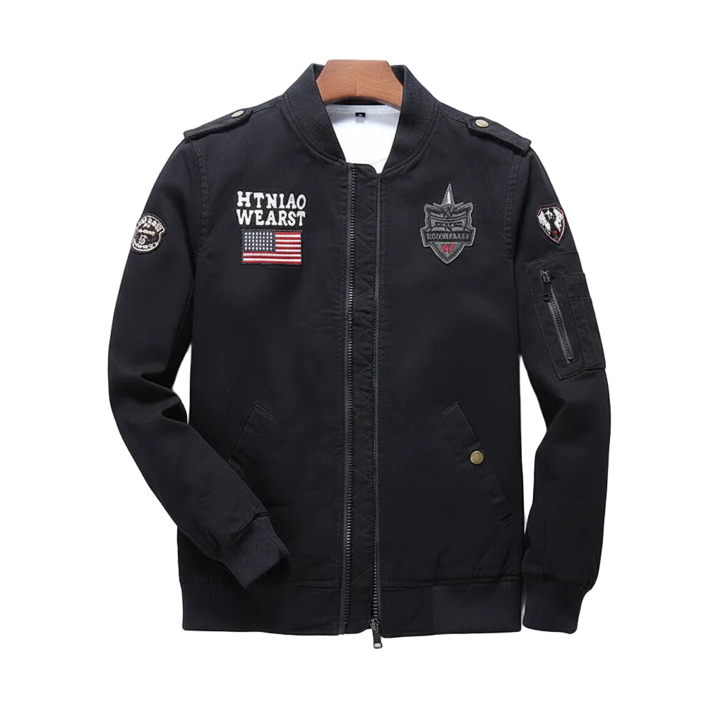 Black jacket with visible branding on a wooden surface