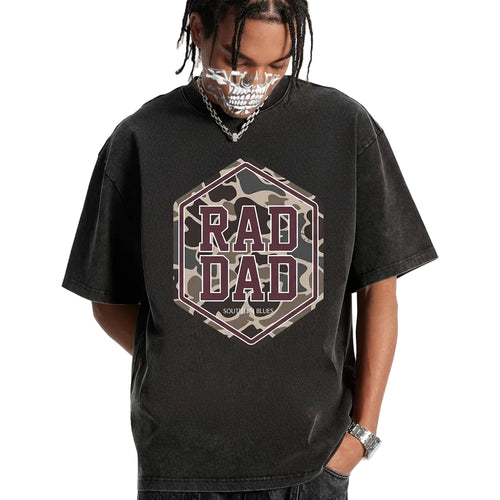 Person wearing a black t-shirt with 'RAD DAD' graphic design on a white background