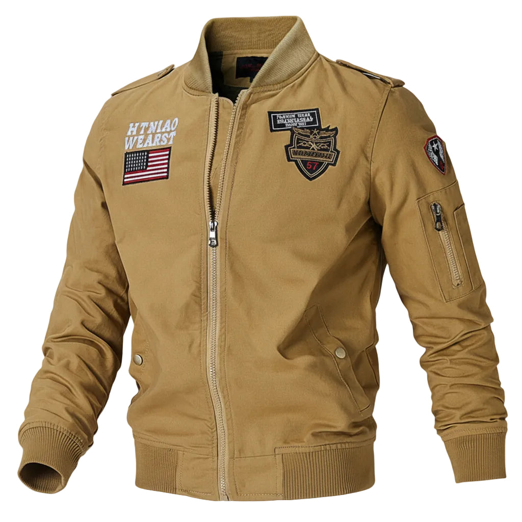 Tan bomber jacket with patches on a gray background