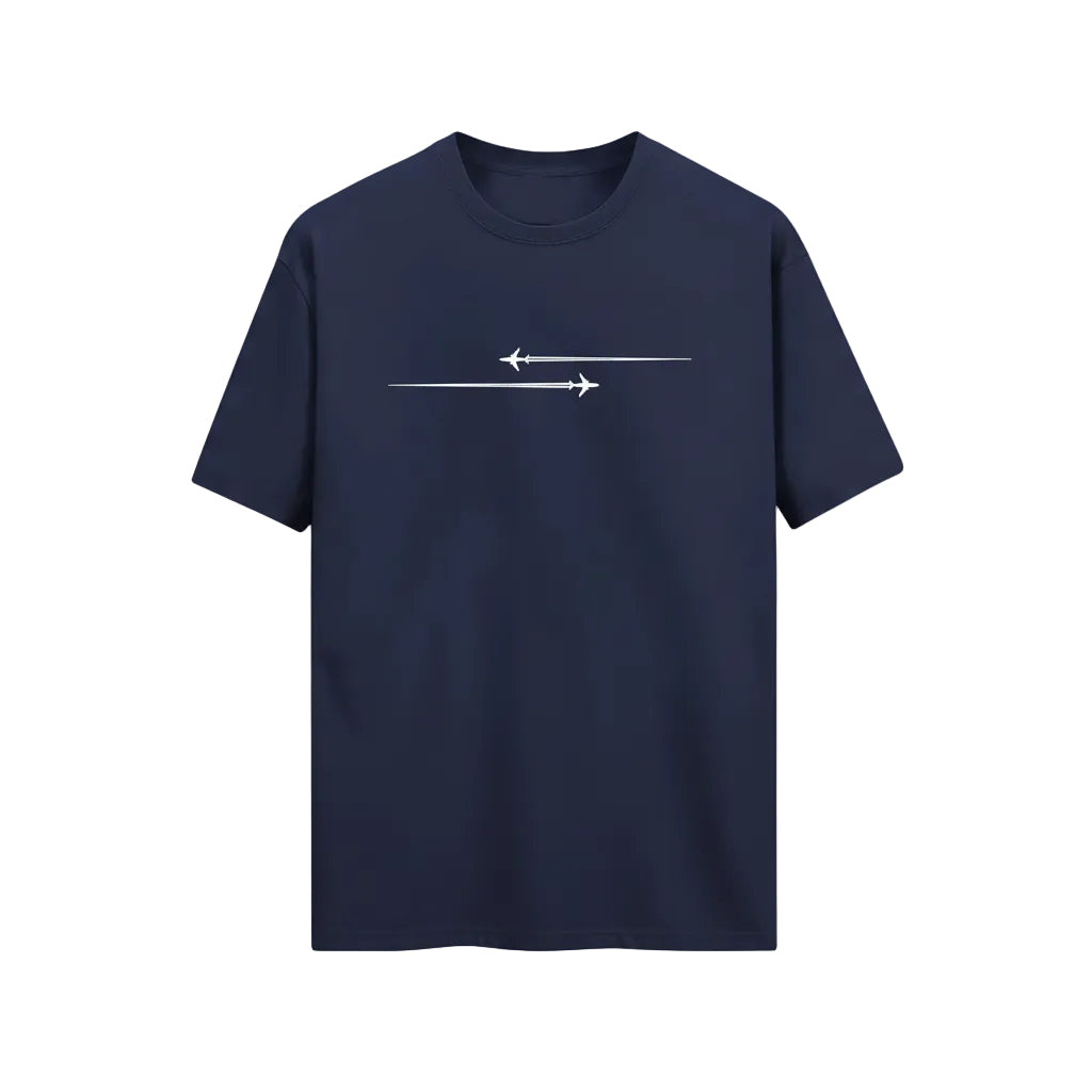 Navy blue t-shirt with white graphic design held in a clothing store.