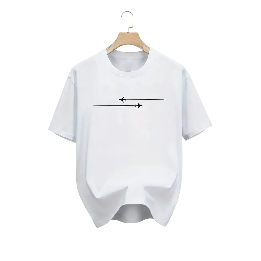 White t-shirt with black arrow design on a hanger in a clothing store.