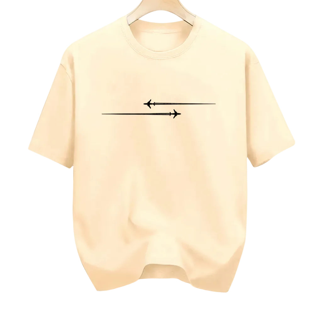 Beige t-shirt with black arrow design in a clothing store setting